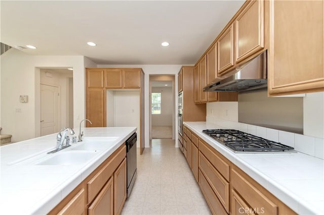 10324 Bold Red Dr, Rancho Cucamonga, CA 91730 - kitchen with stainless steel appliances, under cabinet range hood, tile countertops, and recessed lighting