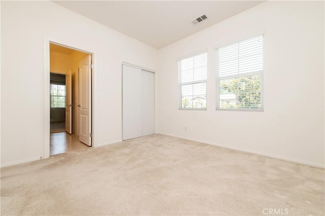 10324 Bold Red Dr, Rancho Cucamonga, CA 91730 - unfurnished bedroom featuring light colored carpet and a closet