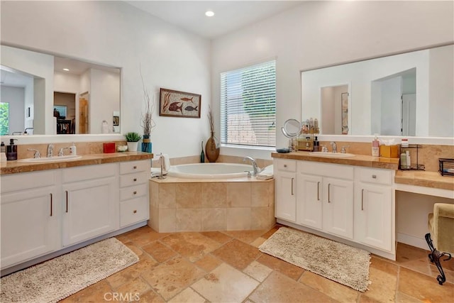48692 Pear St, Indio, CA 92201 - full bath featuring two vanities, a bath, stone tile floors, and recessed lighting