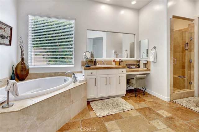 48692 Pear St, Indio, CA 92201 - full bathroom featuring a bath, vanity, a stall shower, and healthy amount of natural light