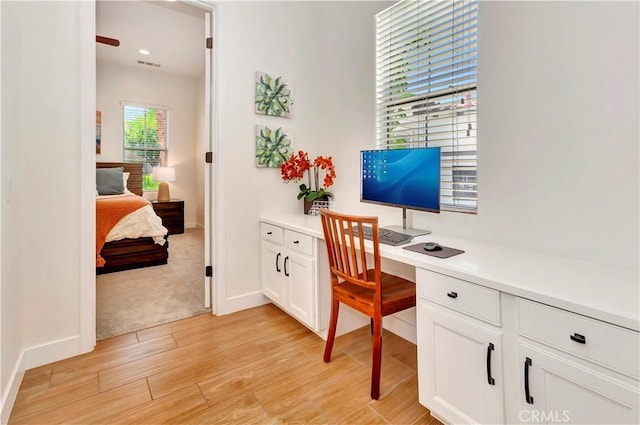 48692 Pear St, Indio, CA 92201 - home office featuring light wood-style floors and built in study area