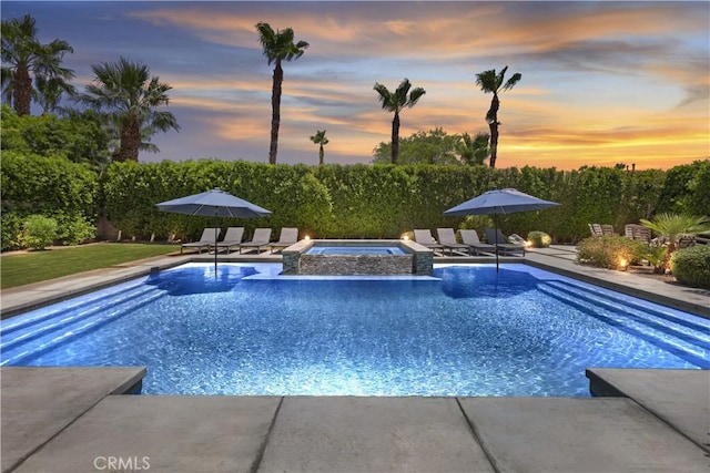 48692 Pear St, Indio, CA 92201 - view of pool featuring a patio and a pool with connected hot tub