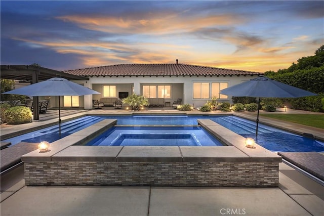 48692 Pear St, Indio, CA 92201 - view of pool featuring an outdoor hangout area, a pool with connected hot tub, and a patio area