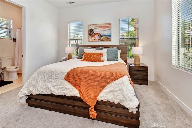 48692 Pear St, Indio, CA 92201 - bedroom featuring carpet flooring, multiple windows, and ensuite bath
