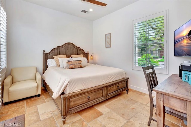 48692 Pear St, Indio, CA 92201 - bedroom featuring stone tile floors, recessed lighting, and a ceiling fan