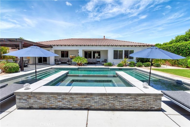 48692 Pear St, Indio, CA 92201 - rear view of property with a pool with connected hot tub, a patio area, and outdoor lounge area
