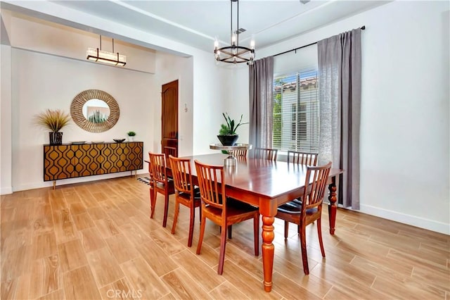 48692 Pear St, Indio, CA 92201 - dining room featuring light wood-type flooring and a chandelier