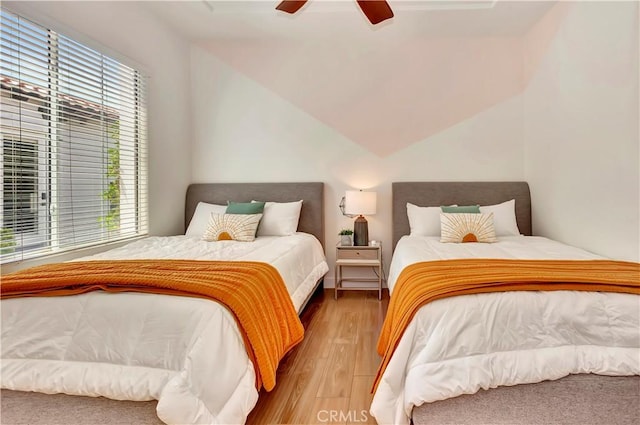 48692 Pear St, Indio, CA 92201 - bedroom featuring multiple windows, wood finished floors, ceiling fan, and vaulted ceiling