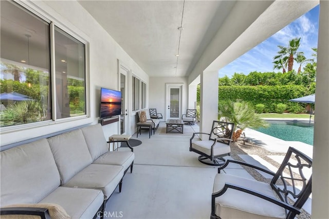 48692 Pear St, Indio, CA 92201 - view of patio / terrace featuring an outdoor pool and an outdoor living space