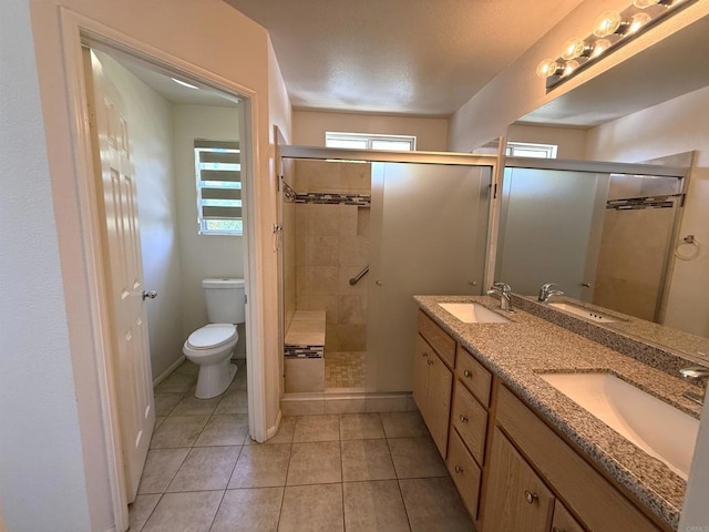 1111 Magellan Way, Chula Vista, CA 91910 - bathroom featuring a stall shower, double vanity, and tile patterned flooring