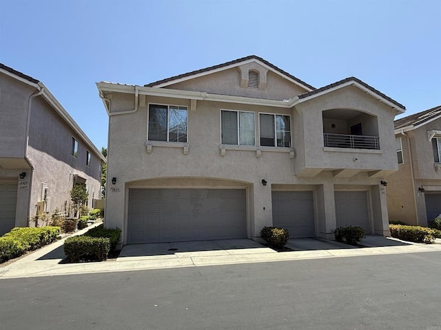 1111 Magellan Way, Chula Vista, CA 91910 - townhome / multi-family property featuring stucco siding, an attached garage, and a balcony
