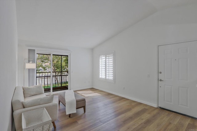 12191 Cuyamaca College Dr E Unit 210, El Cajon, CA 92019 - living area featuring vaulted ceiling and wood finished floors