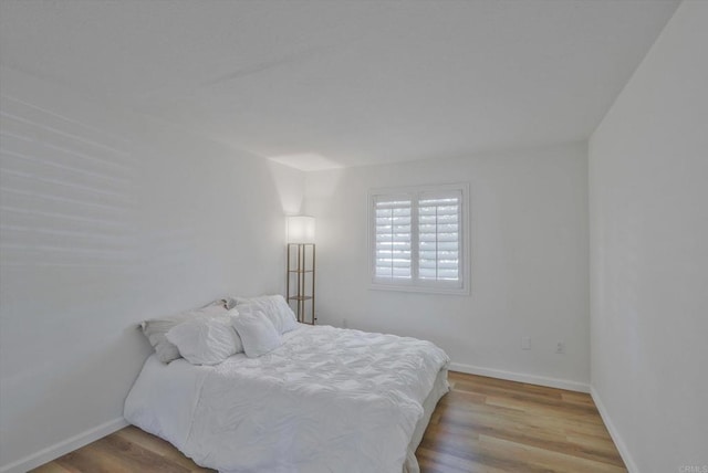 12191 Cuyamaca College Dr E Unit 210, El Cajon, CA 92019 - bedroom featuring wood finished floors and baseboards
