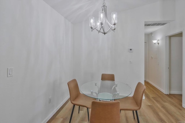 12191 Cuyamaca College Dr E Unit 210, El Cajon, CA 92019 - dining area featuring light wood-style floors and a chandelier