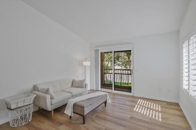 12191 Cuyamaca College Dr E Unit 210, El Cajon, CA 92019 - living room featuring healthy amount of natural light, wood finished floors, and vaulted ceiling