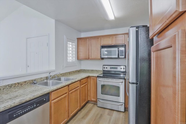 12191 Cuyamaca College Dr E Unit 210, El Cajon, CA 92019 - kitchen with appliances with stainless steel finishes and light wood-style flooring