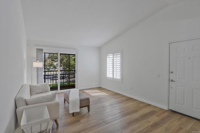 12191 Cuyamaca College Dr E Unit 210, El Cajon, CA 92019 - living area with lofted ceiling and light wood finished floors