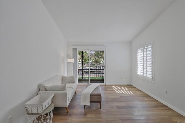 12191 Cuyamaca College Dr E Unit 210, El Cajon, CA 92019 - sitting room with wood finished floors and vaulted ceiling