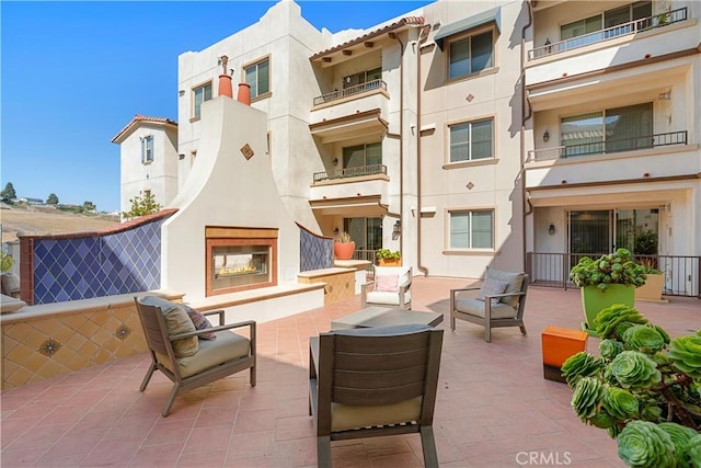 627 Deep Valley Dr Unit 410, Rolling Hills Estates, CA 90274 - view of patio featuring an outdoor living space with a fireplace