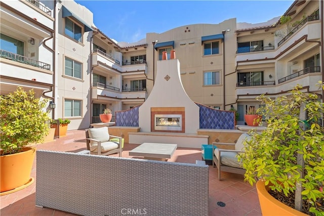 627 Deep Valley Dr Unit 410, Rolling Hills Estates, CA 90274 - view of patio / terrace featuring an outdoor living space with a fireplace