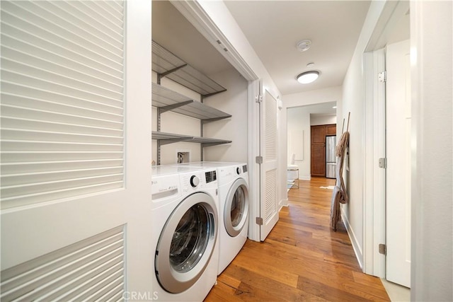 627 Deep Valley Dr Unit 410, Rolling Hills Estates, CA 90274 - washroom with light wood-type flooring and separate washer and dryer