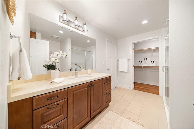 627 Deep Valley Dr Unit 410, Rolling Hills Estates, CA 90274 - full bathroom featuring vanity, a shower stall, tile patterned flooring, a spacious closet, and recessed lighting