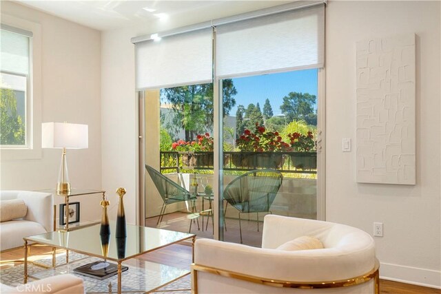 627 Deep Valley Dr Unit 410, Rolling Hills Estates, CA 90274 - sitting room featuring healthy amount of natural light and wood finished floors