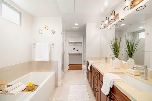 627 Deep Valley Dr Unit 410, Rolling Hills Estates, CA 90274 - bathroom featuring double vanity, a garden tub, a shower stall, tile patterned flooring, and recessed lighting