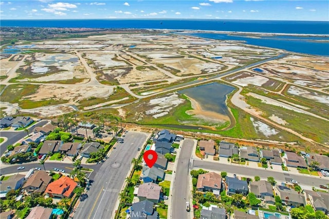 18202 Foss Ln, Huntington Beach, CA 92648 - aerial view of property and surrounding area with nearby suburban area and a large body of water