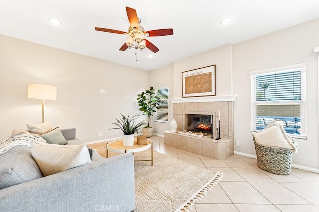 18202 Foss Ln, Huntington Beach, CA 92648 - living room with a ceiling fan, light tile patterned floors, recessed lighting, and a tile fireplace