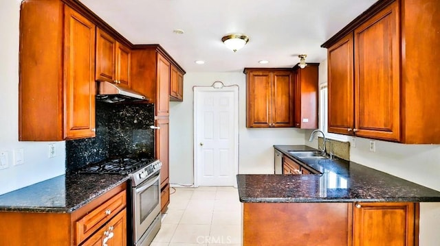 7360 Thunderbird Ln, Stanton, CA 90680 - kitchen featuring stainless steel gas range oven, under cabinet range hood, a peninsula, tasteful backsplash, and light tile patterned floors