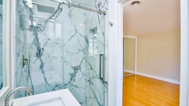 7360 Thunderbird Ln, Stanton, CA 90680 - full bath with a marble finish shower and wood finished floors