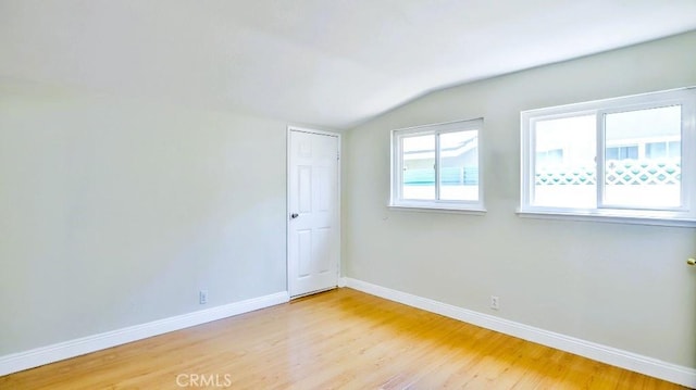 7360 Thunderbird Ln, Stanton, CA 90680 - spare room with lofted ceiling and light wood-style flooring