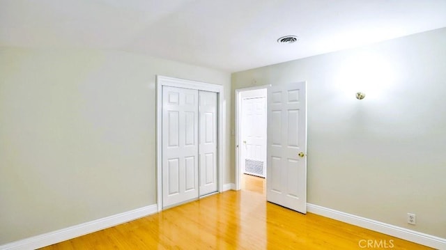 7360 Thunderbird Ln, Stanton, CA 90680 - unfurnished bedroom with light wood-style flooring and a closet