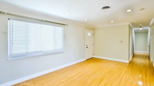 7360 Thunderbird Ln, Stanton, CA 90680 - spare room with ornamental molding, light wood-style floors, and recessed lighting