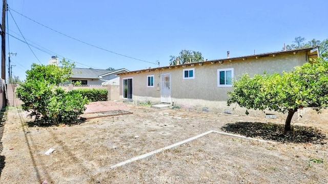 7360 Thunderbird Ln, Stanton, CA 90680 - back of house featuring stucco siding