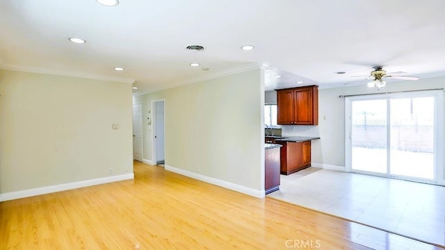 7360 Thunderbird Ln, Stanton, CA 90680 - kitchen with crown molding, a ceiling fan, recessed lighting, open floor plan, and light wood-type flooring