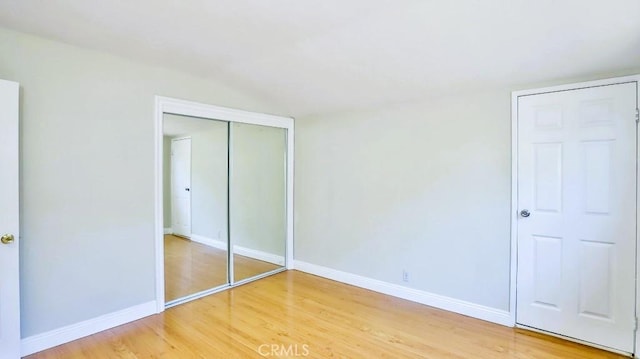 7360 Thunderbird Ln, Stanton, CA 90680 - unfurnished bedroom with wood finished floors and a closet