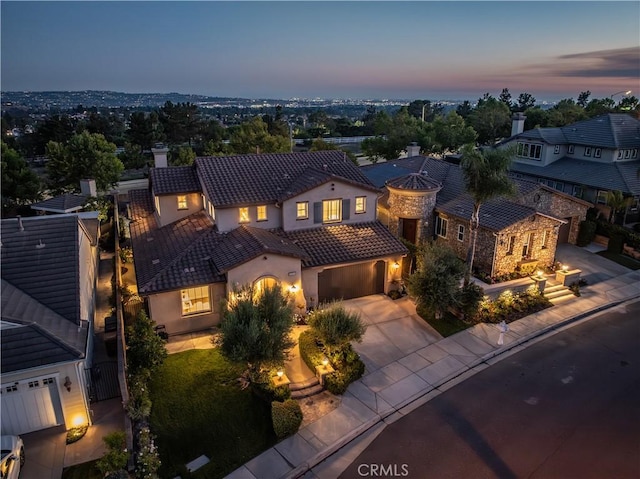 20100 Livorno Ln, Yorba Linda, CA 92886 - view of front of home featuring a tiled roof, driveway, stucco siding, a chimney, and an attached garage
