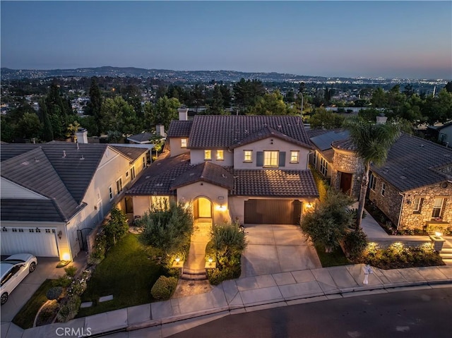20100 Livorno Ln, Yorba Linda, CA 92886 - view of front of home featuring a tile roof, driveway, stucco siding, a chimney, and a garage