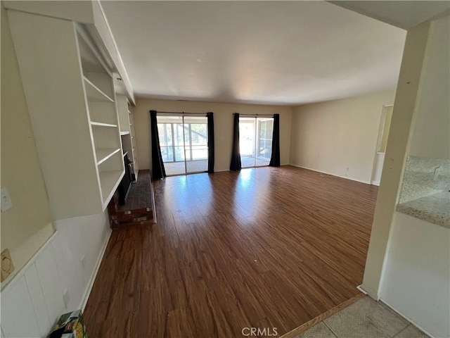 43216 San Miguel Way, Hemet, CA 92544 - unfurnished living room featuring dark wood-style flooring