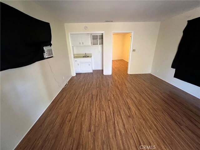 43216 San Miguel Way, Hemet, CA 92544 - unfurnished living room featuring dark wood-style flooring and built in features