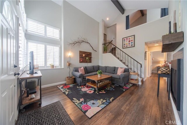 2614 S Quarry Ln Unit D, Walnut, CA 91789 - living room featuring wood finished floors, high vaulted ceiling, beam ceiling, stairway, and an office area
