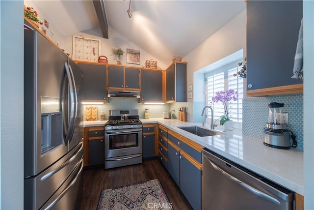 2614 S Quarry Ln Unit D, Walnut, CA 91789 - kitchen with stainless steel appliances, dark wood-style floors, light countertops, and tasteful backsplash