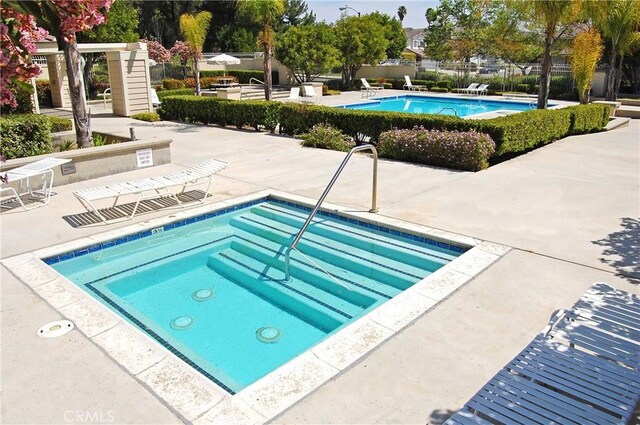 2614 S Quarry Ln Unit D, Walnut, CA 91789 - community pool featuring a community hot tub and a patio