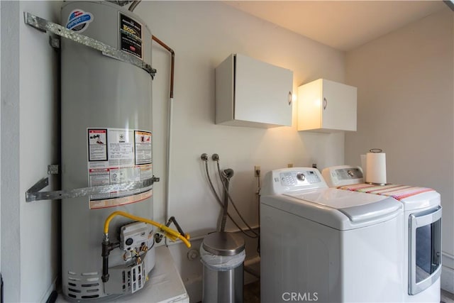 2614 S Quarry Ln Unit D, Walnut, CA 91789 - laundry room with water heater, washing machine and clothes dryer, and cabinet space