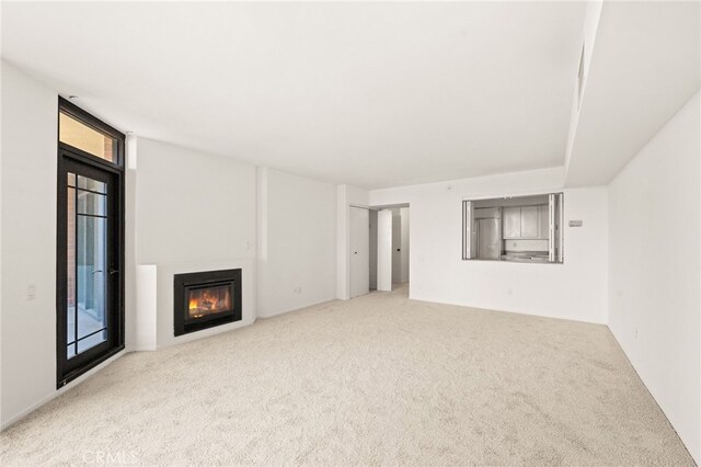500 W Harbor Dr Unit 808, San Diego, CA 92101 - unfurnished living room with carpet and a glass covered fireplace
