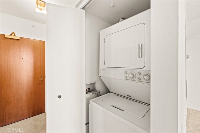 500 W Harbor Dr Unit 808, San Diego, CA 92101 - washroom with stacked washing machine and dryer and carpet