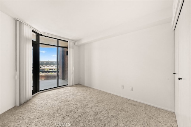 500 W Harbor Dr Unit 808, San Diego, CA 92101 - empty room featuring a wall of windows and carpet