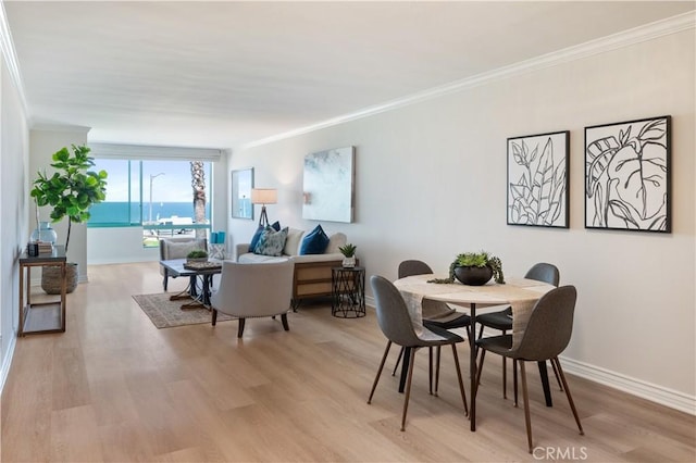 201 Calle Miramar Unit 8, Redondo Beach, CA 90277 - dining area with ornamental molding and light wood-style floors